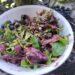 Blueberry Basil Vinaigrette atop salad of arugula and spring mix, fresh blueberries, and pumpkin seeds